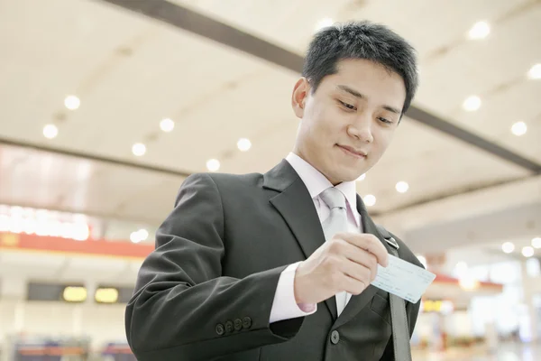 Businessman Checking the Ticket — Stock Photo, Image