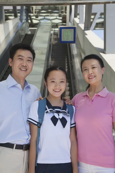 Family standing next to the escalator — Stock Photo, Image