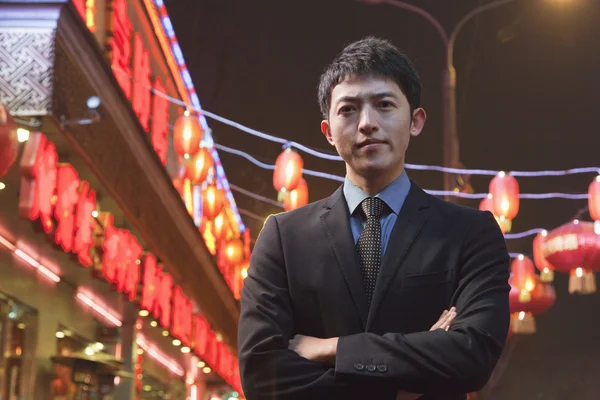 Businessman standing on the street — Stock Photo, Image