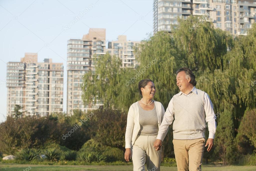 Mature couple walking in the park