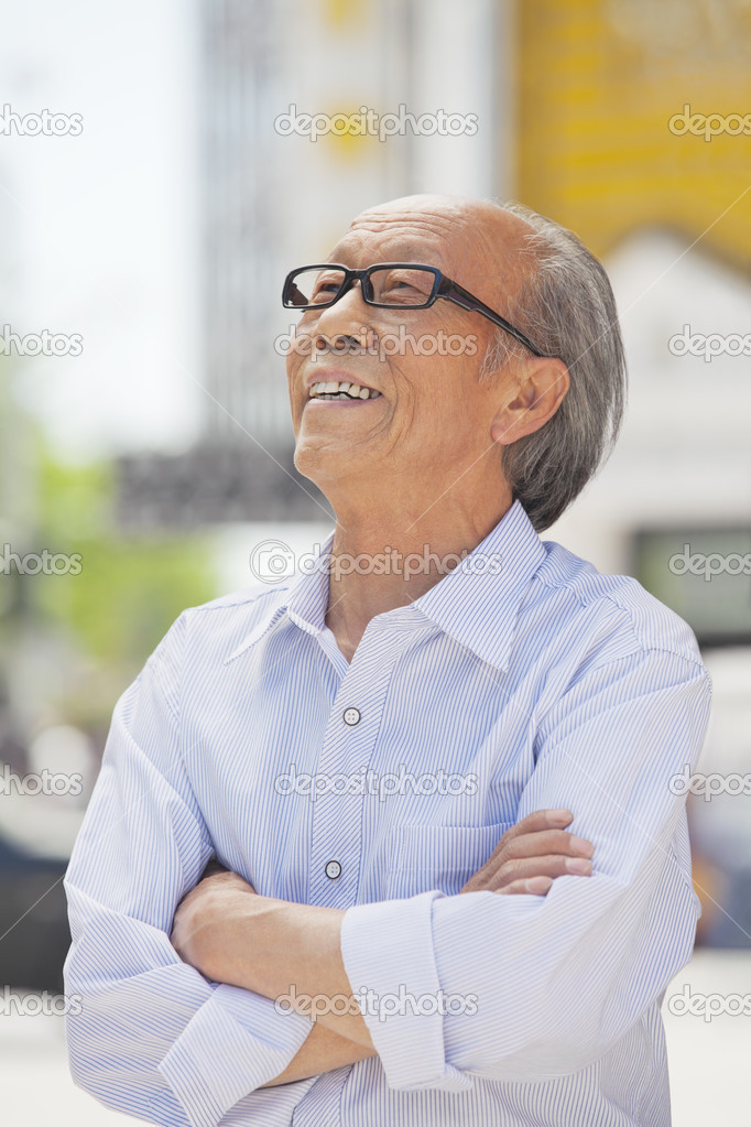 Senior man, arms crossed