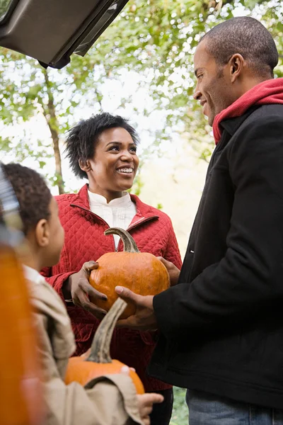 Family with pumpkins — Stock Photo, Image