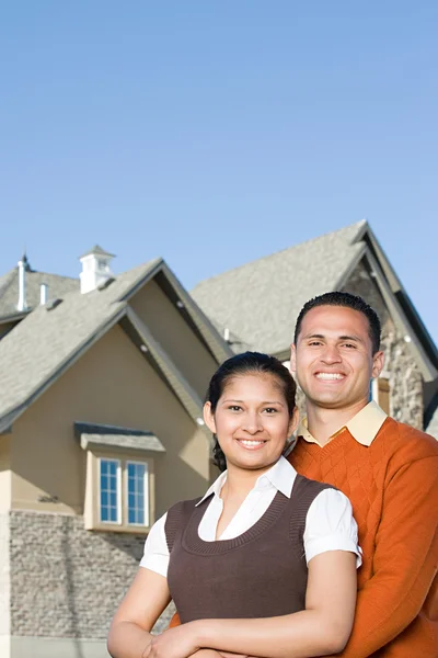 Couple outside of house Stock Image