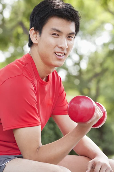 Man exercising with Dumbbell — Stock Photo, Image