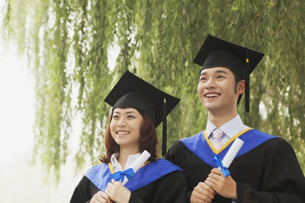 University Graduates Holding Diplomas — Stock Photo, Image