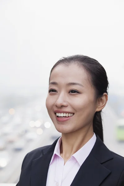 Businesswoman with Traffic Below — Stock Photo, Image