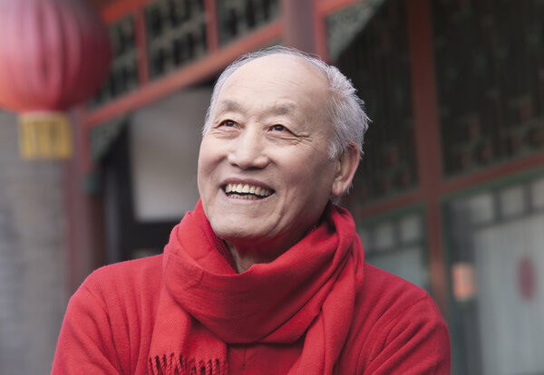 Senior Man in Traditional Chinese Courtyard