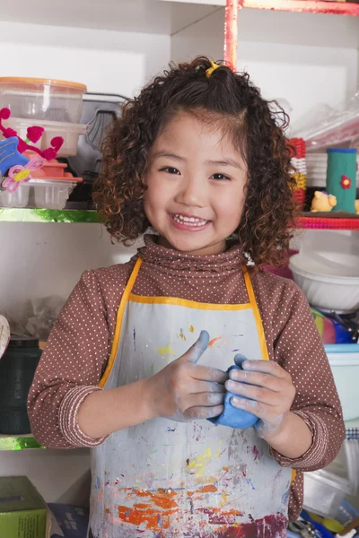 Girl Wearing Apron and Playing with Clay — Stock Photo, Image