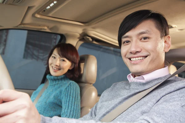 Couple sitting in car — Stock Photo, Image