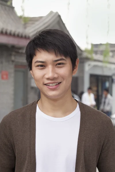 Young Man looking at camera outdoors — Stock Photo, Image