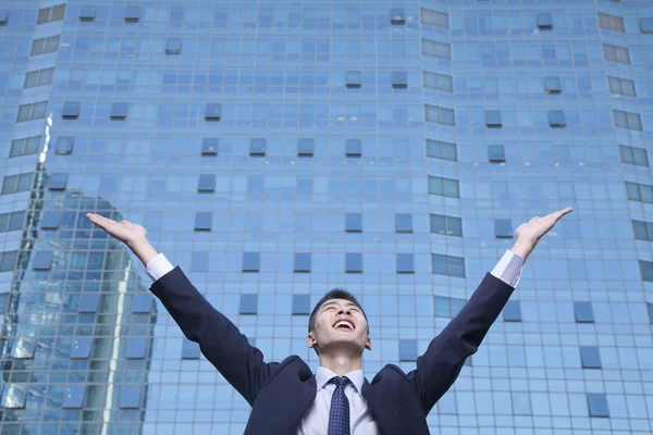 Businessman with arms raised — Stock Photo, Image