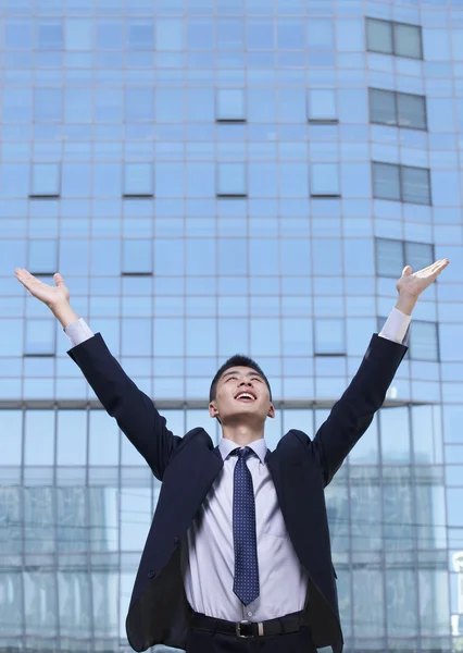 Businessman with arms raised — Stock Photo, Image