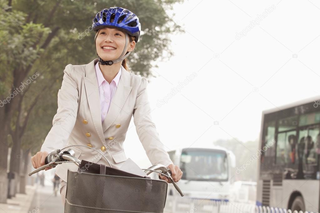 Business Woman commuting with a Bicycle