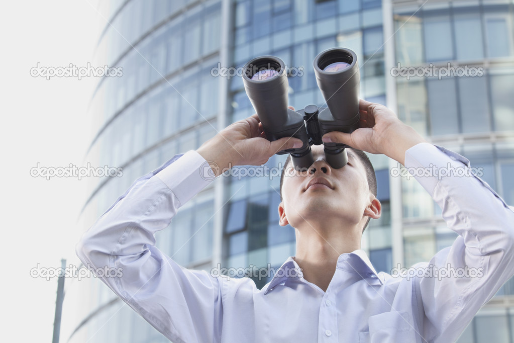 Businessman Looking Through Binoculars