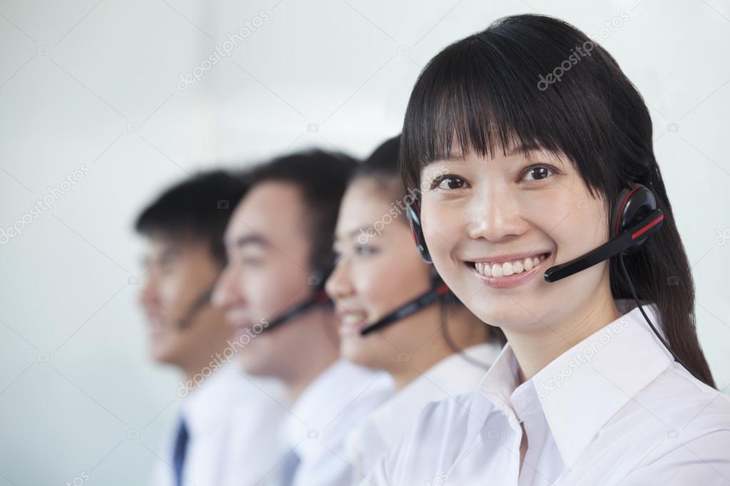 White Collar workers in a row with headsets