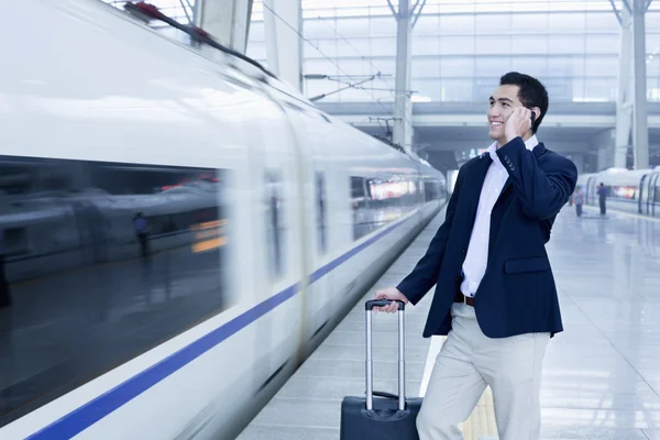 Businessman on the railroad platform — Stock Photo, Image