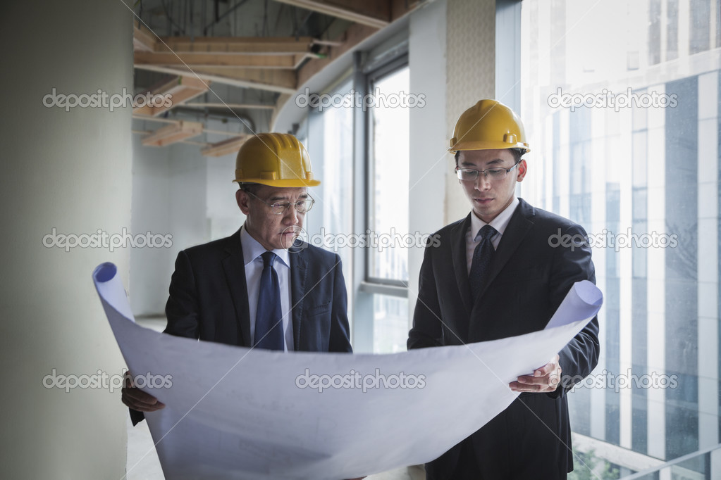 Architects examining a blueprint