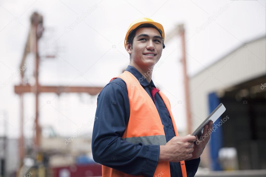 Young worker in a shipping yard