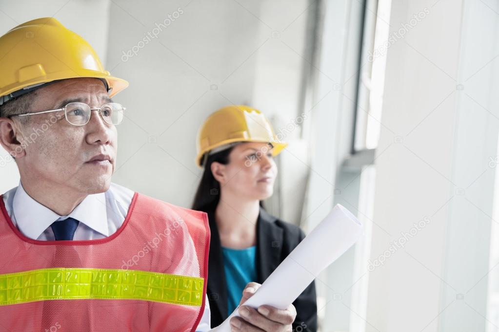 Architects in protective workwear