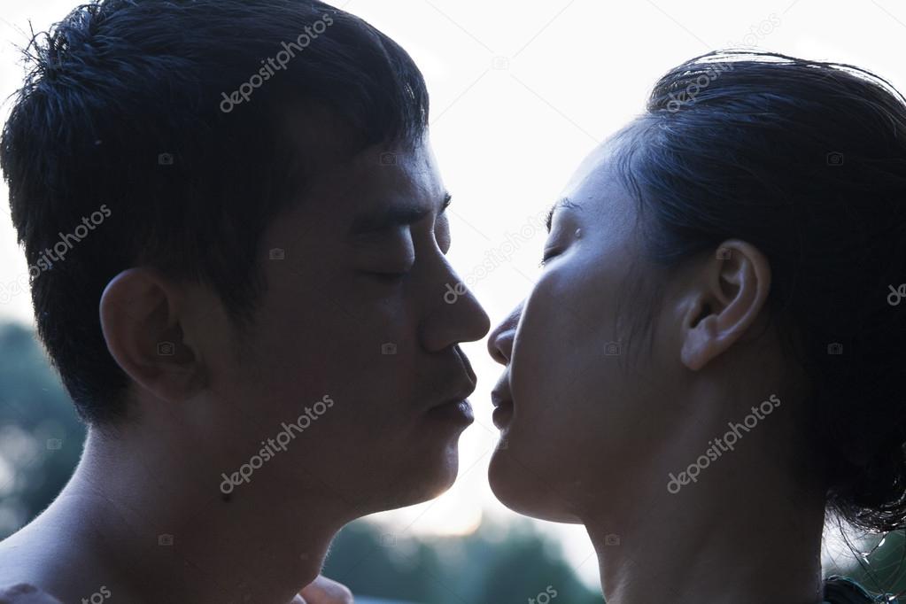 Couple almost kissing