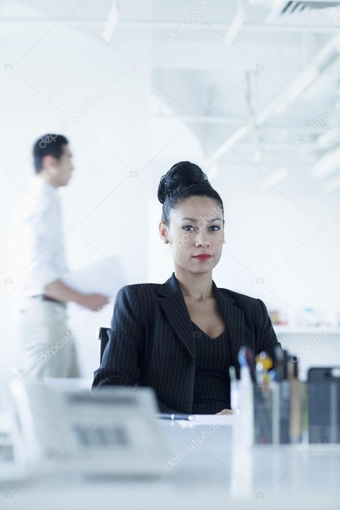 Businesswoman sitting at her desk in the office