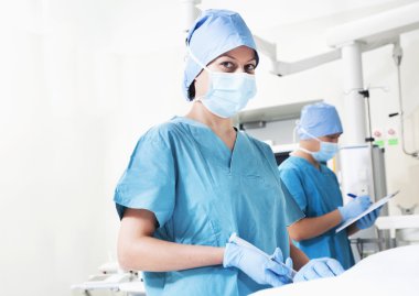 Surgeon working in the operating room clipart
