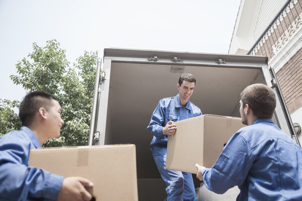 Movers unloading a moving van