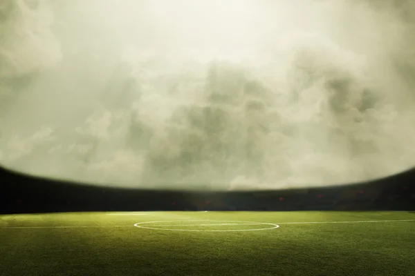 Soccer field and cloudy sky