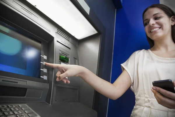 Woman withdrawing money from the ATM — Stock Photo, Image