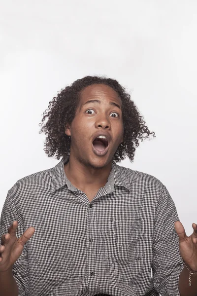 Shocked and surprised young man — Stock Photo, Image