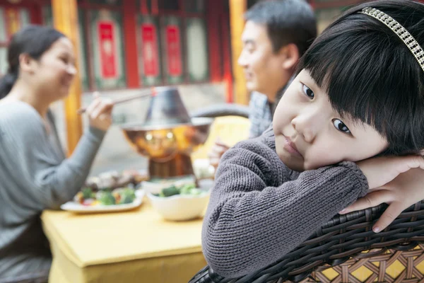 Tired little girl at family meal — Stock Photo, Image