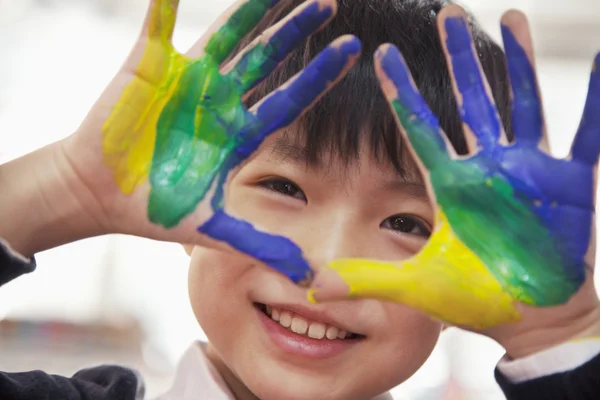 Schoolboy finger painting, close up on hands — Stock Photo, Image