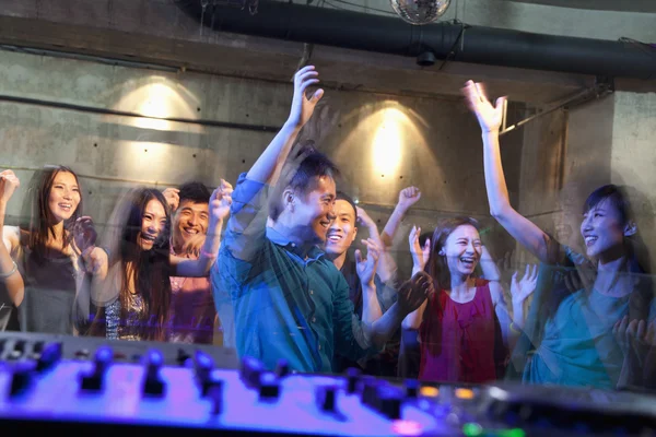 DJ's deck of a crowd dancing in nightclub — Stock Photo, Image