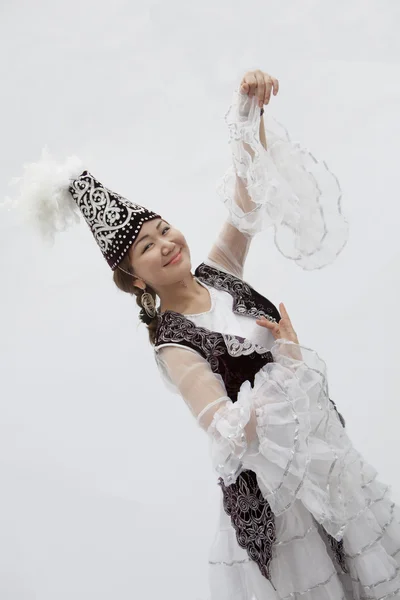 Woman dancing in traditional clothing from Kazakhstan — Stock Photo, Image