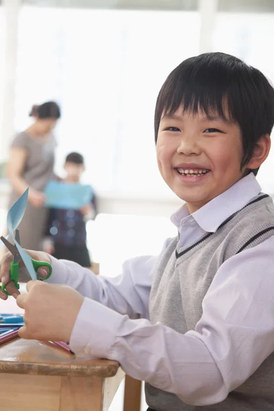 Portrait of Schoolboy doing arts and crafts — Stock Photo, Image