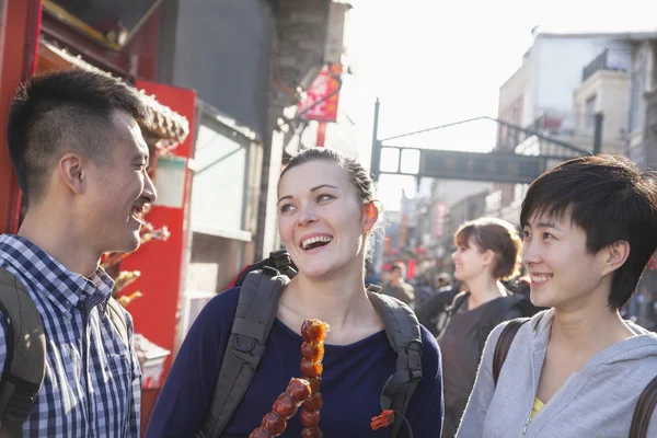 Young people with candied haw — Stock Photo, Image