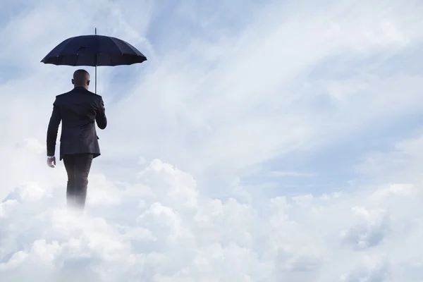 Üzletember esernyővel a kezében. — Stock Fotó