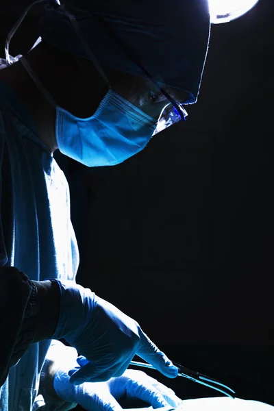 Surgeon holding surgical equipment — Stock Photo, Image