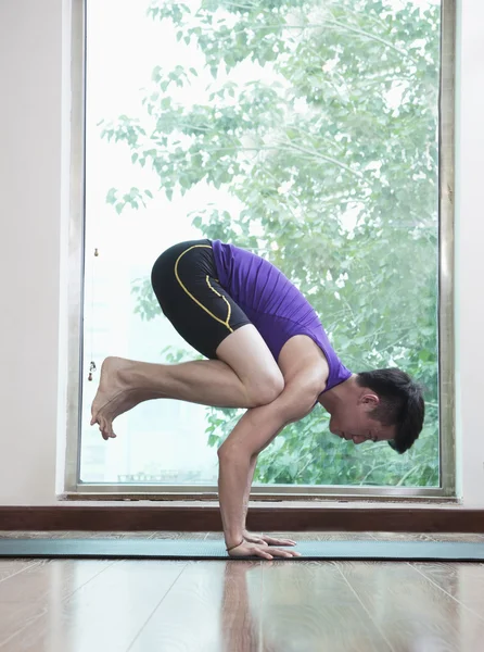 Man in a yoga position — Stock Photo, Image