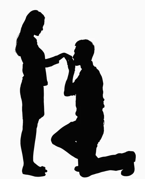 Silhouette of man on one knee, kissing woman's hand — Stock Photo, Image