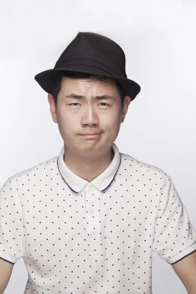 Serious young man wearing a hat — Stock Photo, Image