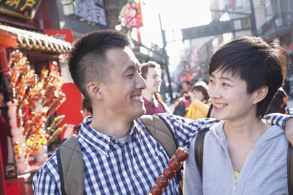 Couple with candied haw — Stock Photo, Image