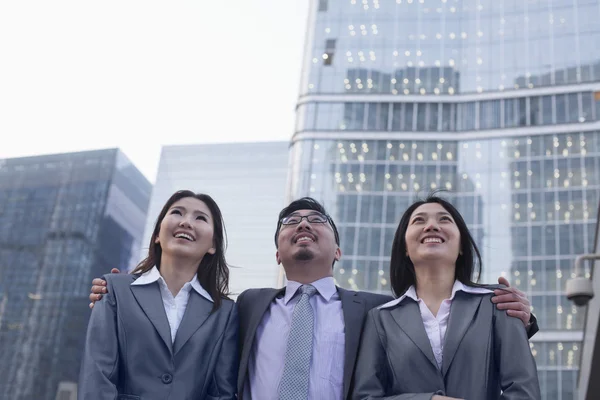 Business people in a row outdoors — Stock Photo, Image