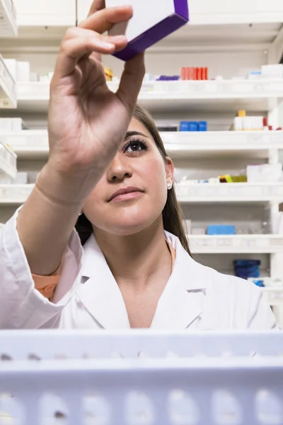 Pharmacist examining prescription medication — Stock Photo, Image