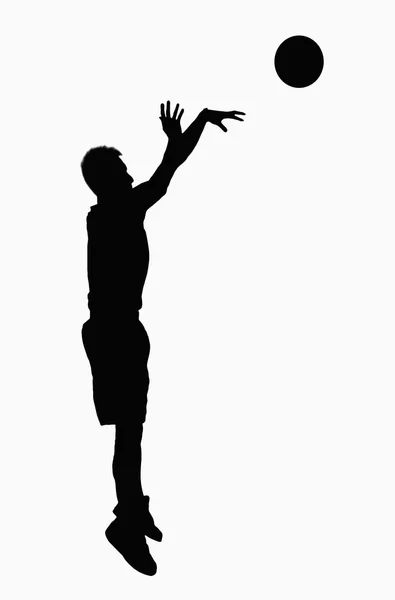 Silhouette eines Basketballspielers — Stockfoto