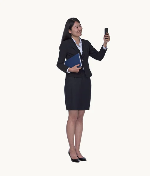 Businesswoman looking at her phone — Stock Photo, Image