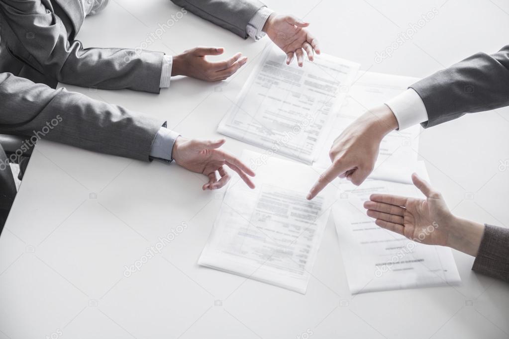 Business people during a business meeting, hands only