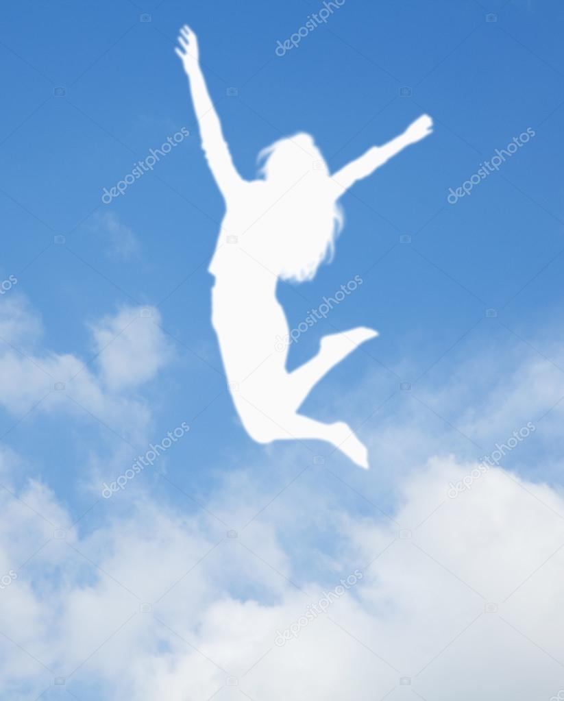 Silhouette of young woman jumping and cheering