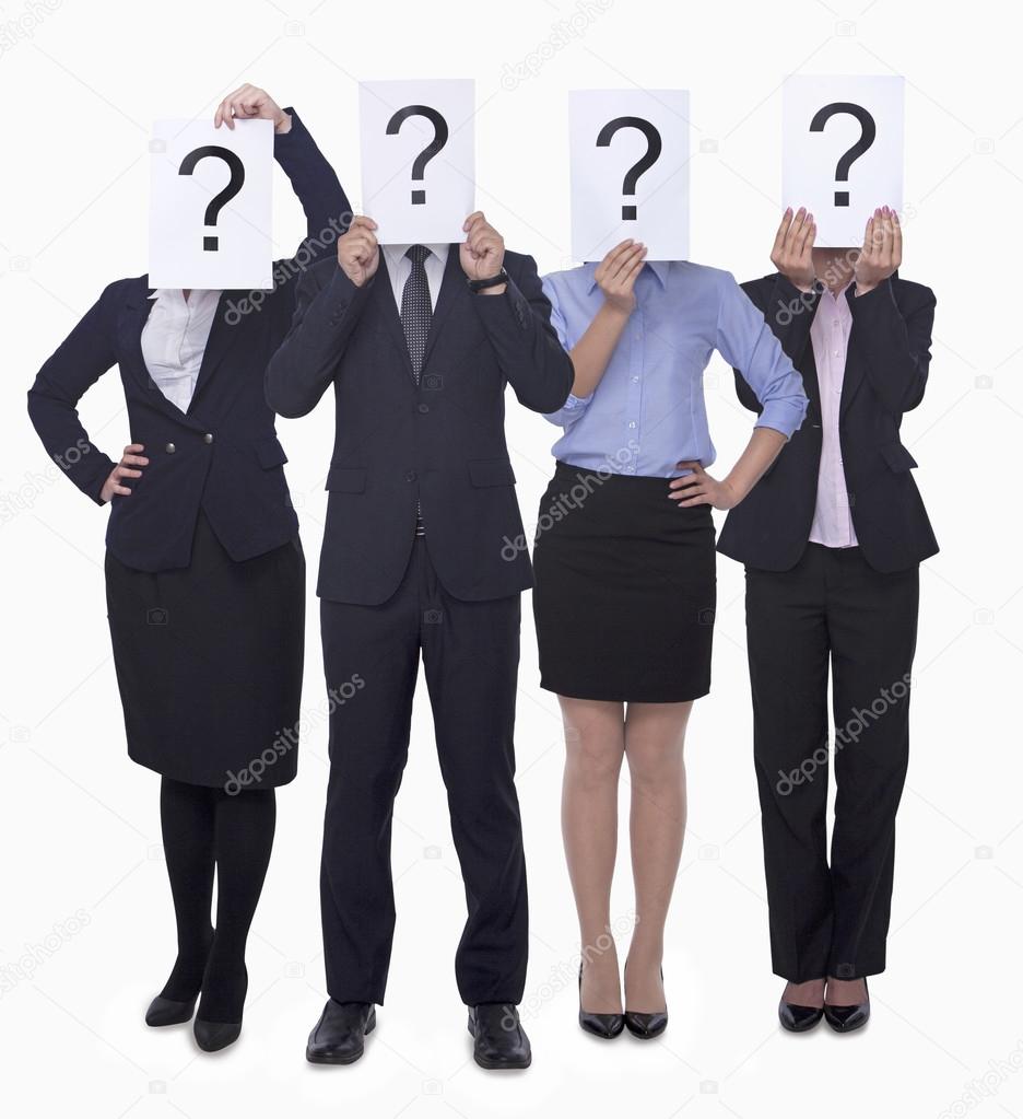 Business people holding up paper with question mark