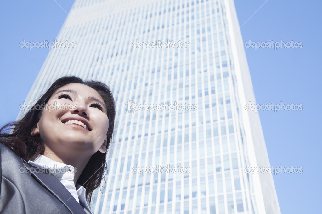 Businesswoman by Chinas world trade center building